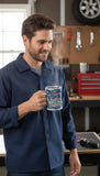 Man holding a mug in a workshop setting