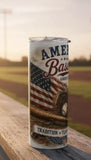 American Baseball tumbler on a wooden railing with a baseball field background